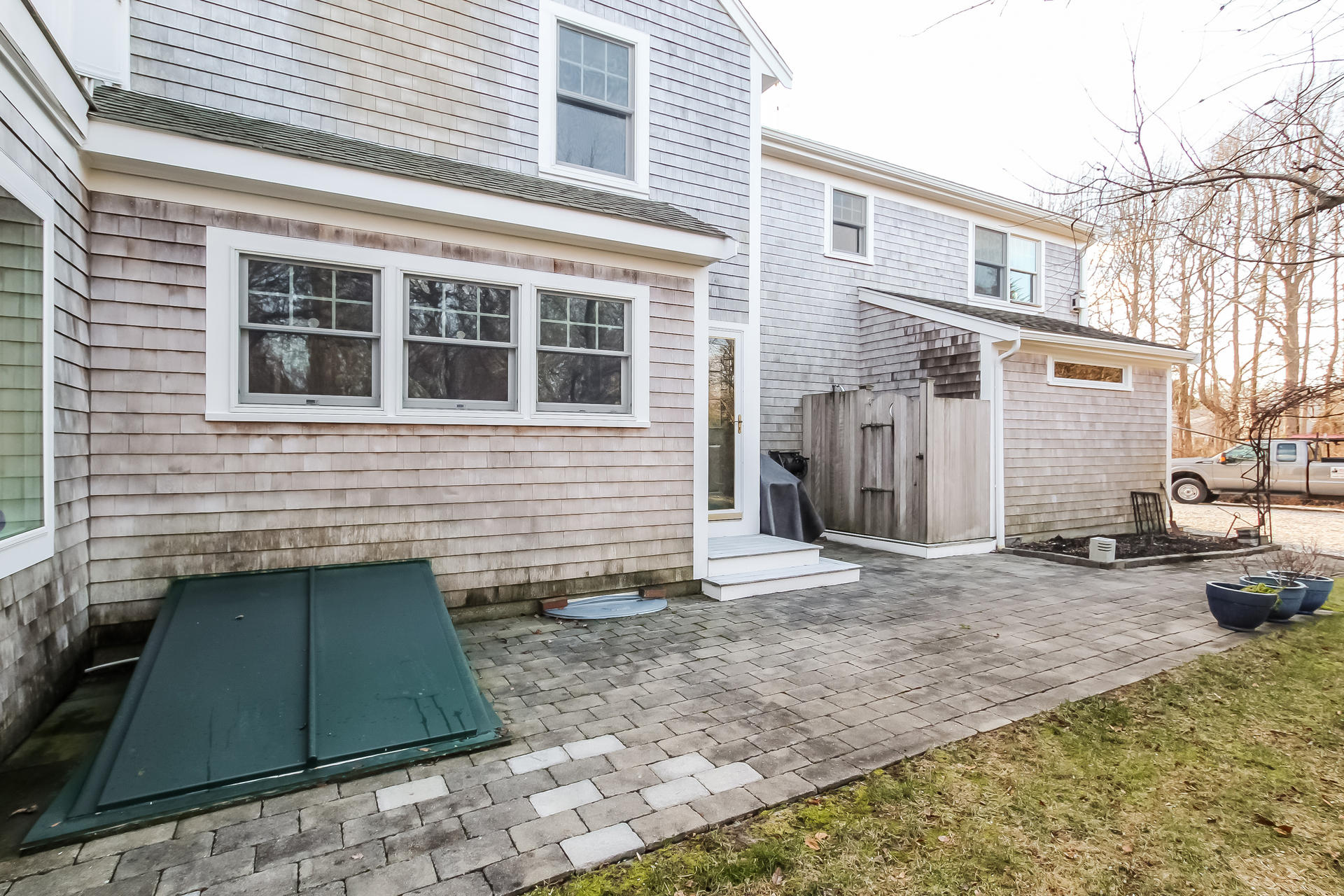 79 Stoney Point Road Cummaquid, MA 02675 - Photo 26 of 34 a view of a house with backyard and sitting area