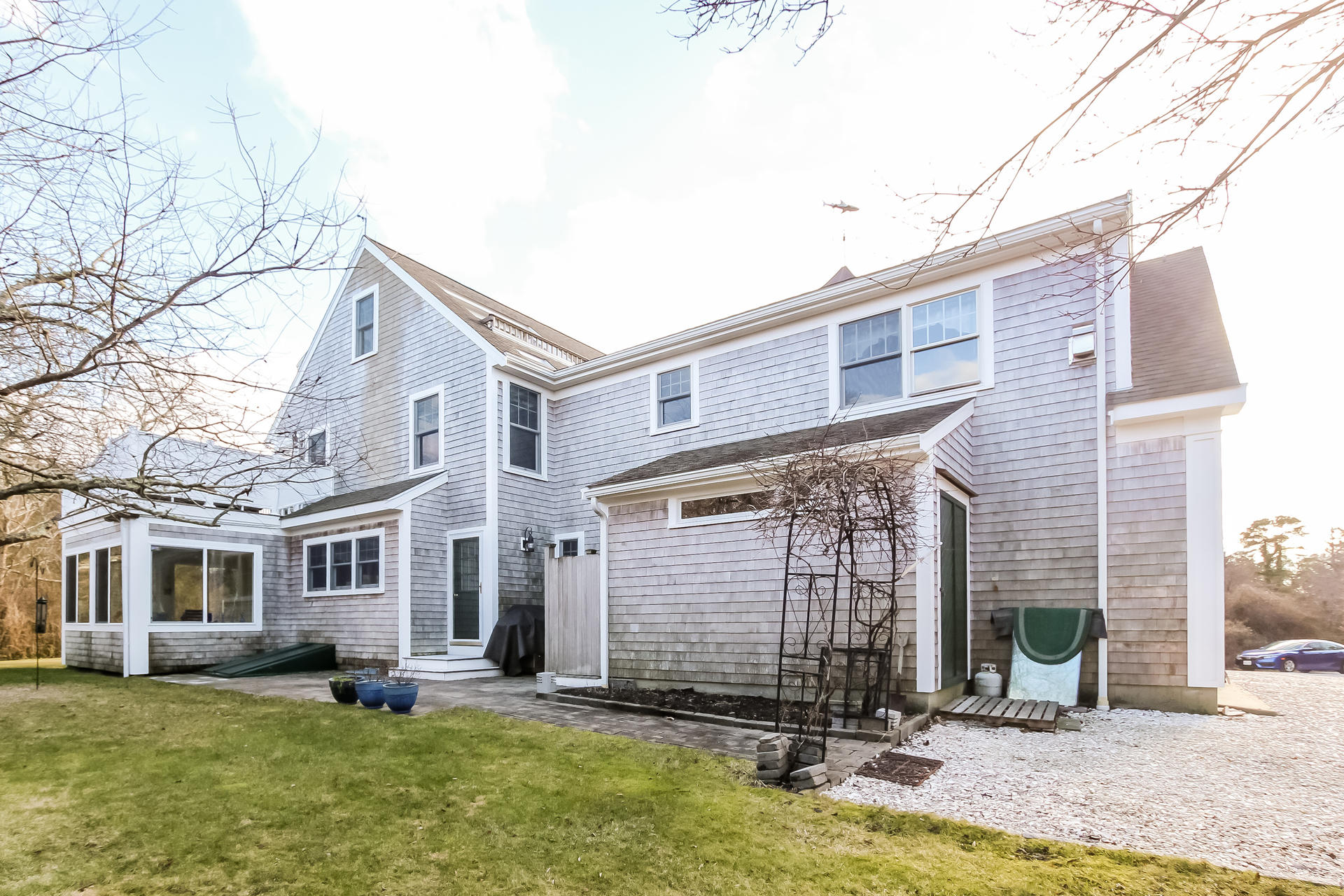 79 Stoney Point Road Cummaquid, MA 02675 - Photo 28 of 34 a view of a house with a yard and sitting area
