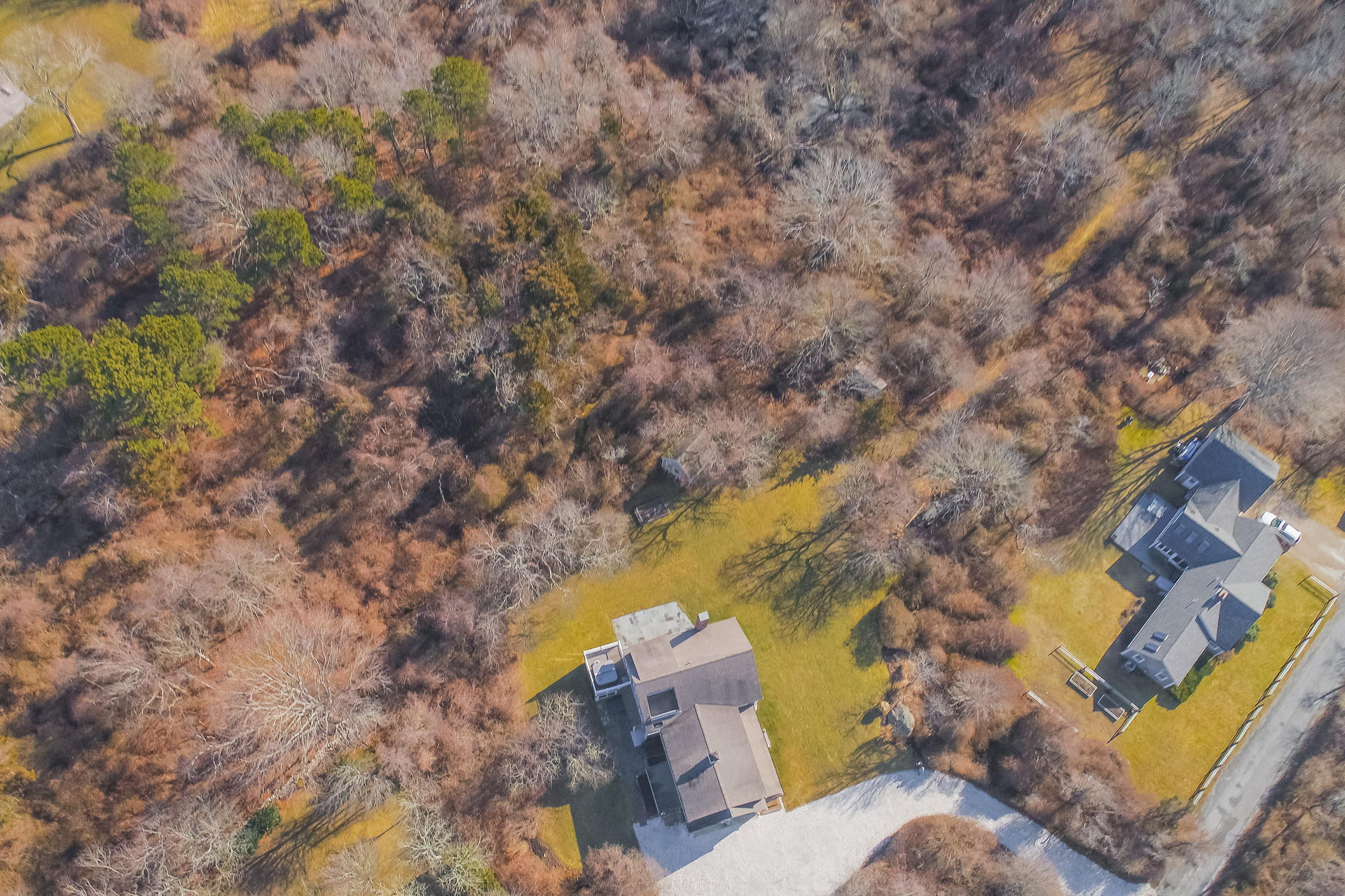 79 Stoney Point Road Cummaquid, MA 02675 - Photo 34 of 34 a aerial view of a house with a yard and wooden fence