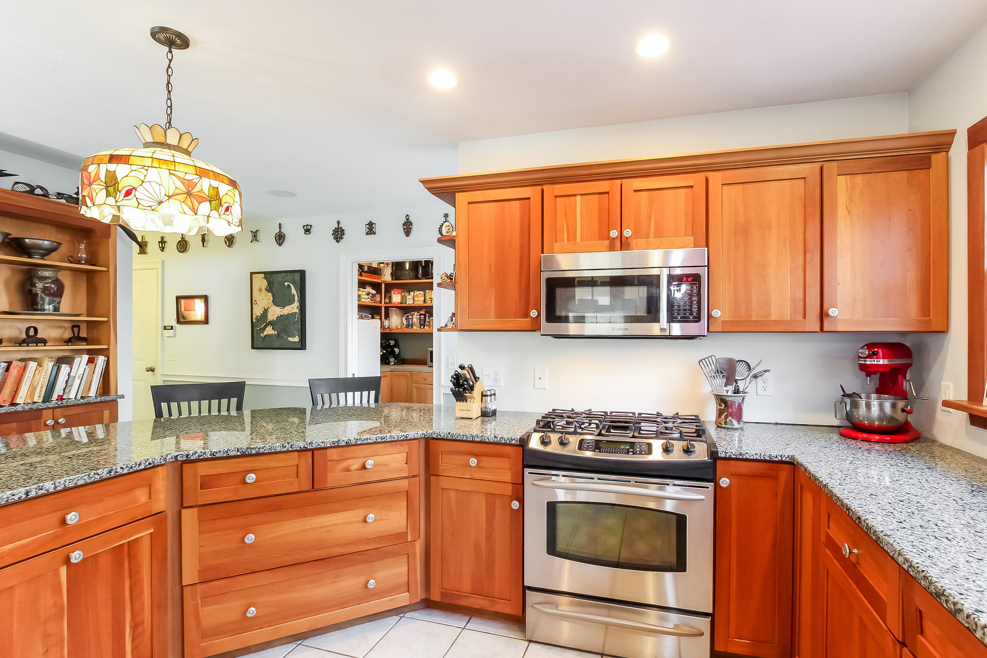 79 Stoney Point Road Cummaquid, MA 02675 - Photo 9 of 34 a kitchen with stainless steel appliances granite countertop a stove a sink and a microwave