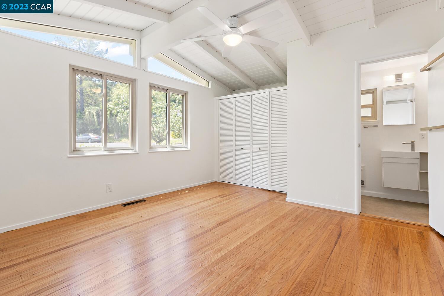 3374 Mildred Lane Lafayette, CA 94549 - Photo 19 of 34 a view of an empty room with a window and wooden floor