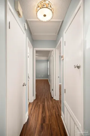 a bathroom with a granite countertop sink a toilet and a mirror