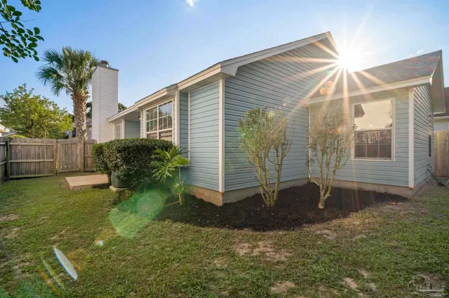 a backyard of a house with a garden