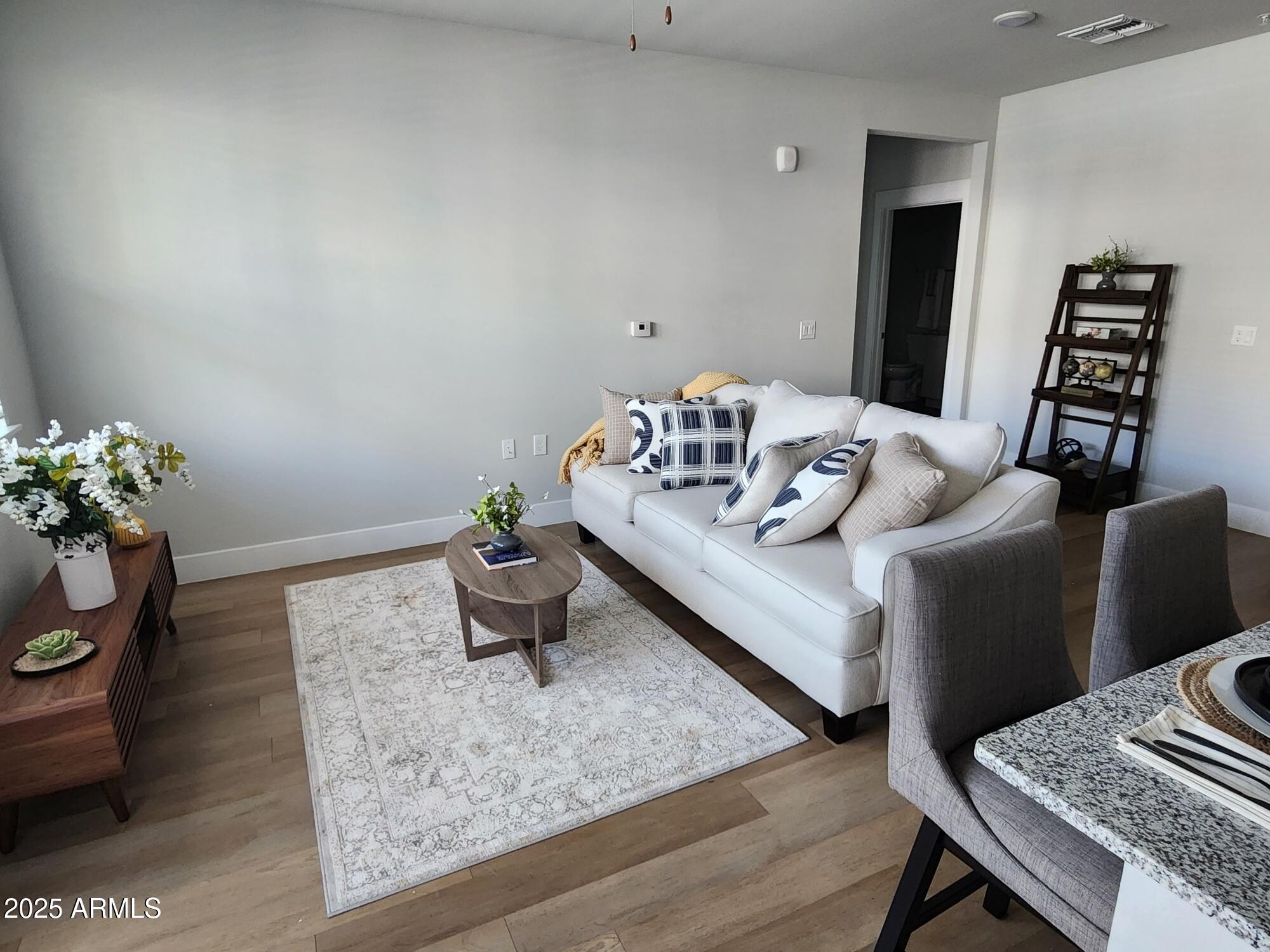 4755 East Southern Avenue, Unit A4 Mesa, AZ 85206 - Photo 2 of 19 a living room with furniture