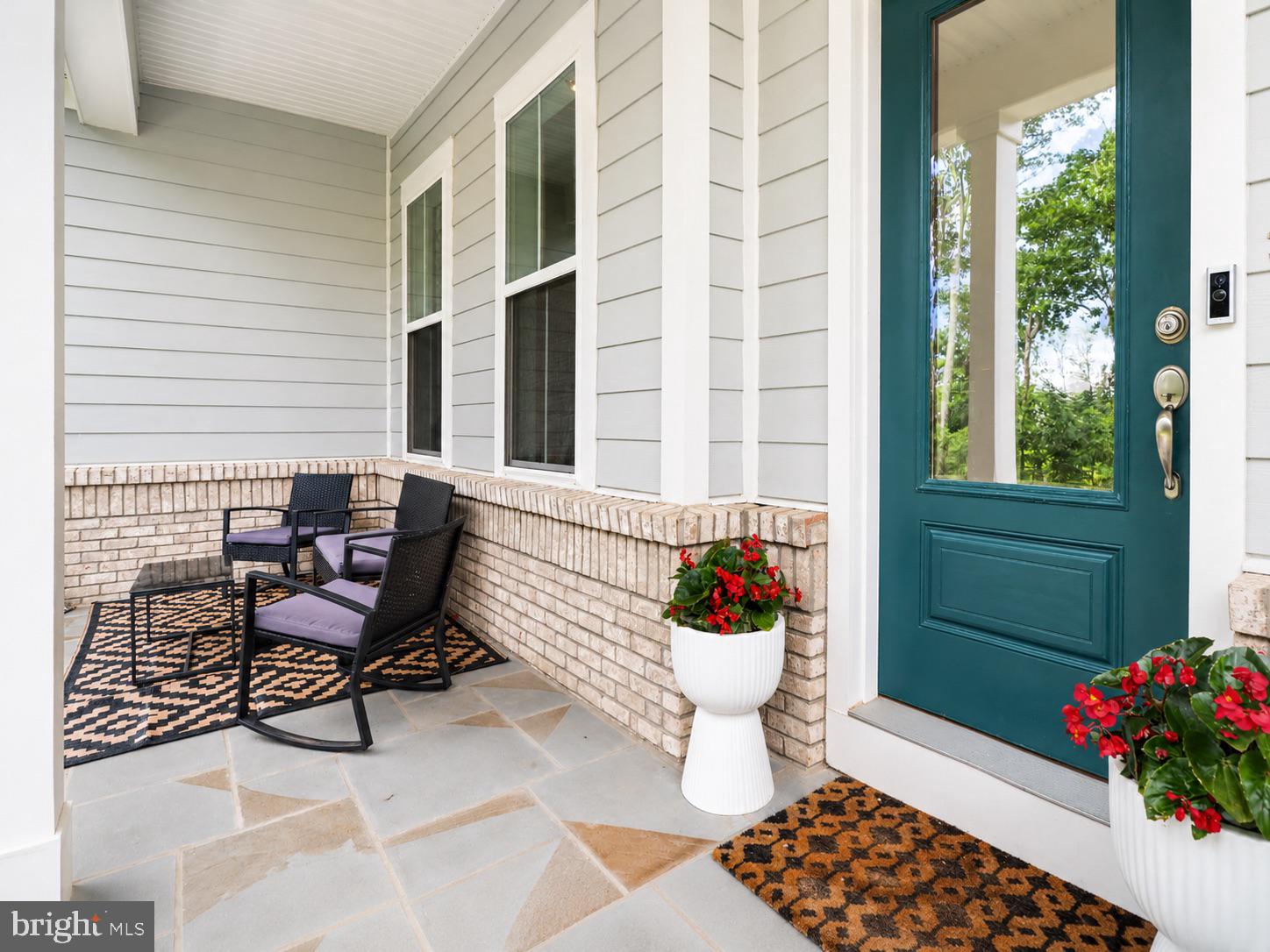 23609 Roselle Ridge Lane Aldie, VA 20105 - Photo 6 of 75 Charming porch with inviting greenery.