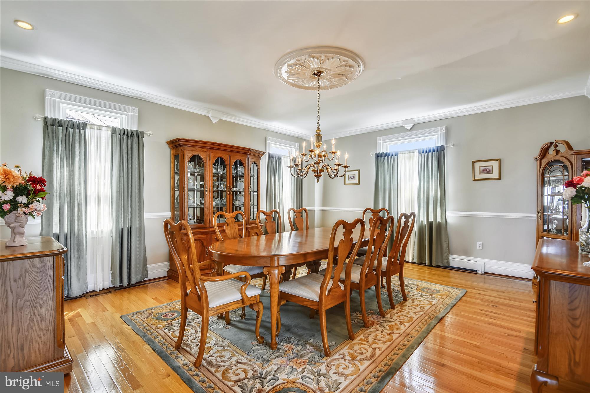 9109 Cuckold Point Road Baltimore, MD 21219 - Photo 11 of 37 a view of a dining room with furniture window and wooden floor