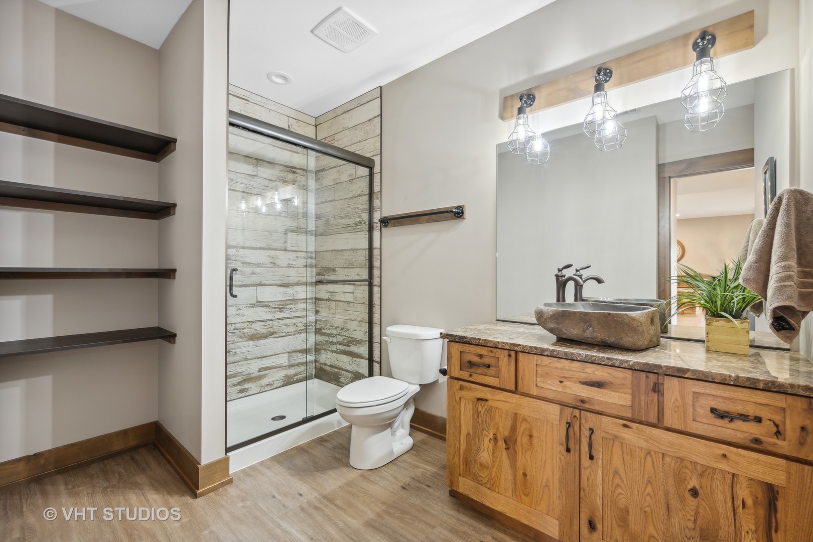 790 Robertson Road South Elgin, IL 60177 - Photo 26 of 31 a bathroom with a granite countertop sink a toilet a mirror and shower