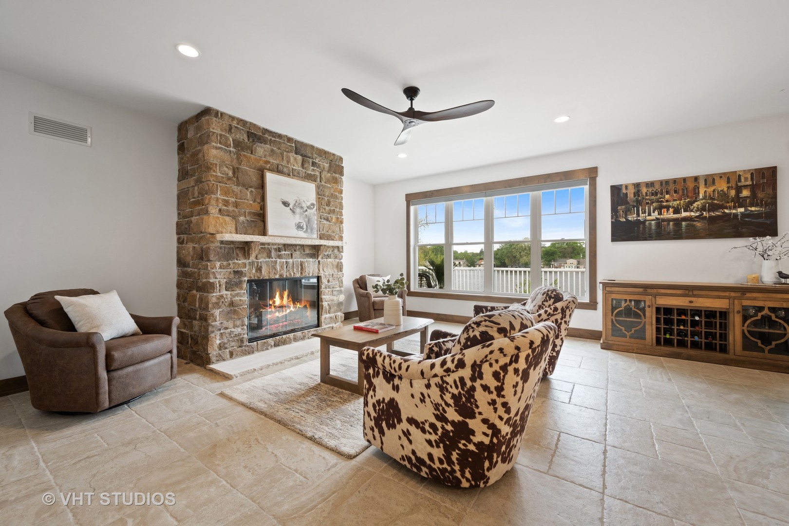 790 Robertson Road South Elgin, IL 60177 - Photo 6 of 31 a living room with furniture a fireplace and a flat screen tv