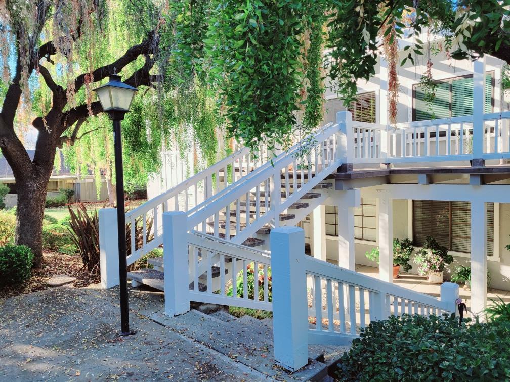 a view of balcony with small garden