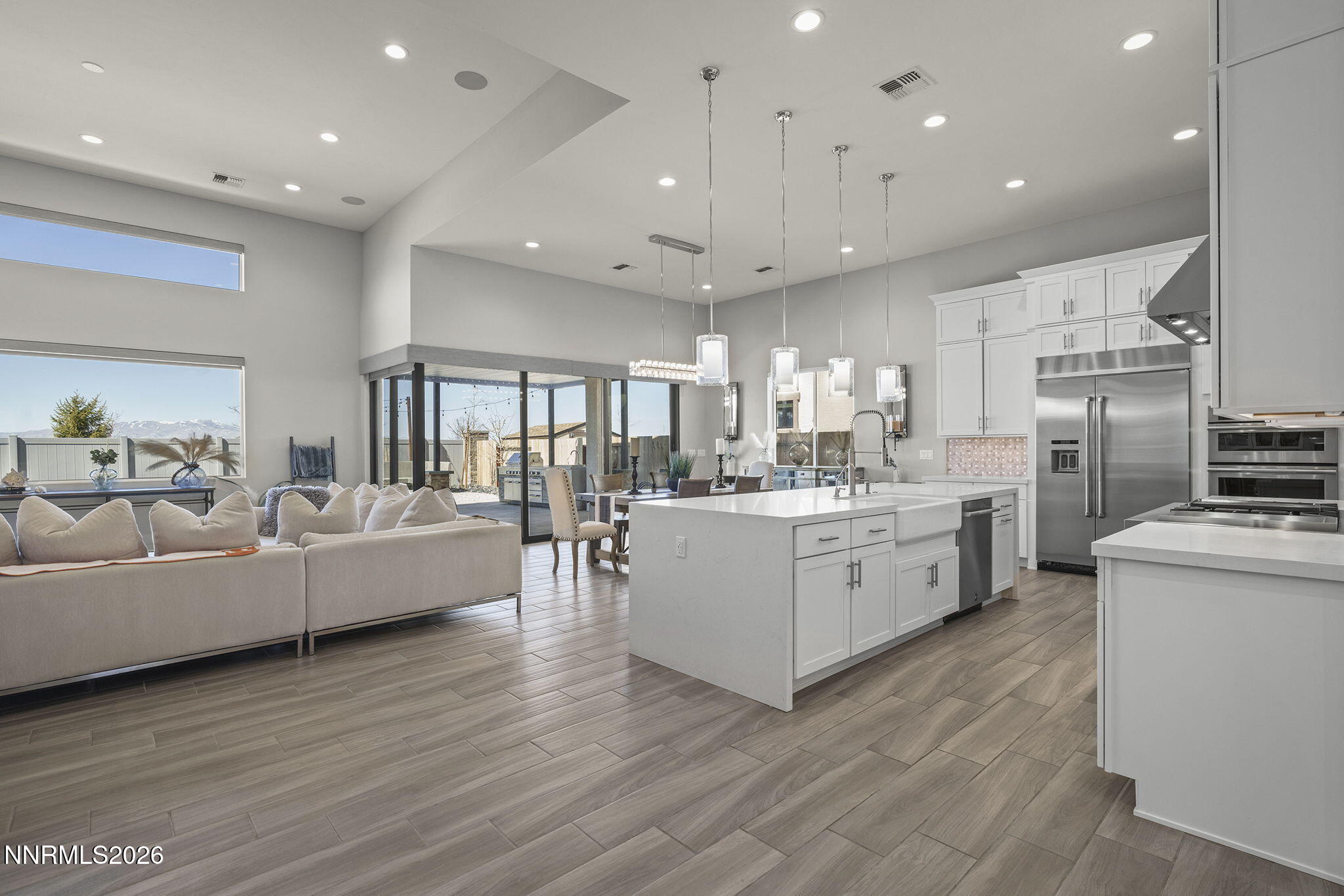 2945 Ruby Desert Drive Reno, NV 89521 - Photo 13 of 41 a large white kitchen with a large counter top appliances and cabinets