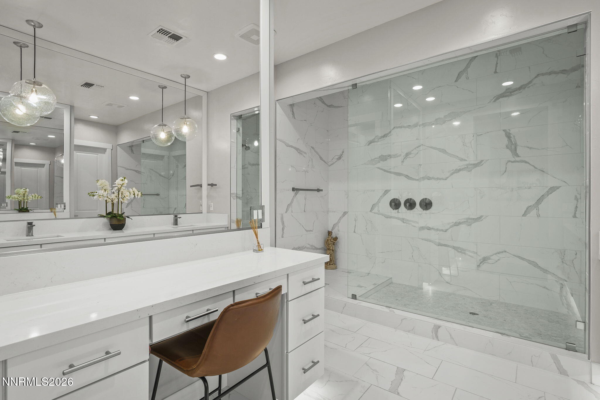 2945 Ruby Desert Drive Reno, NV 89521 - Photo 24 of 41 a large bathroom with a sink a large mirror and shower