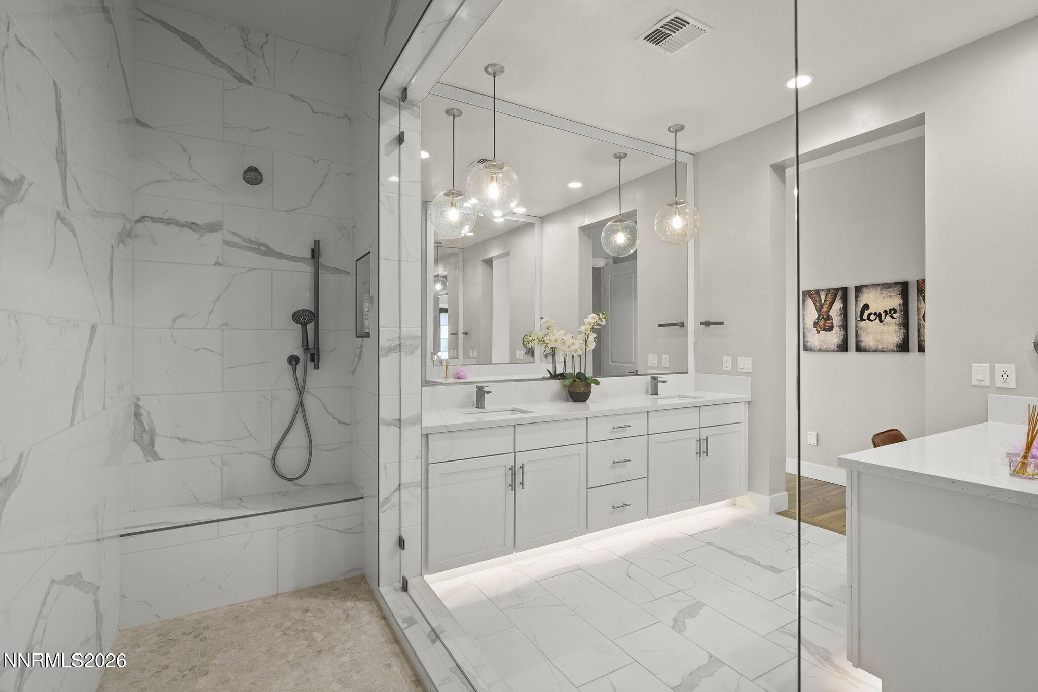 2945 Ruby Desert Drive Reno, NV 89521 - Photo 25 of 41 a bathroom with a double vanity sink mirror and shower