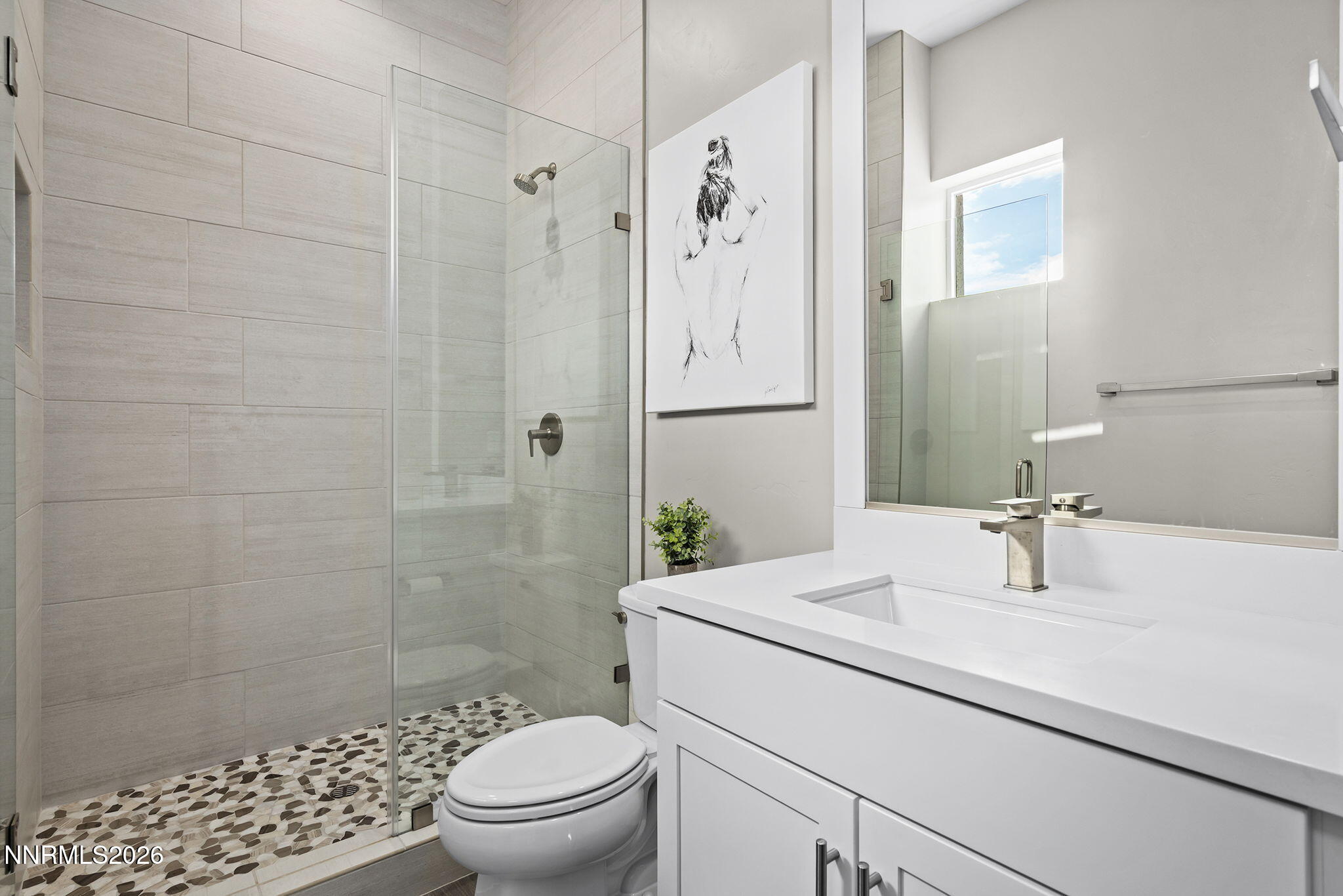2945 Ruby Desert Drive Reno, NV 89521 - Photo 32 of 41 a bathroom with a sink a toilet and shower