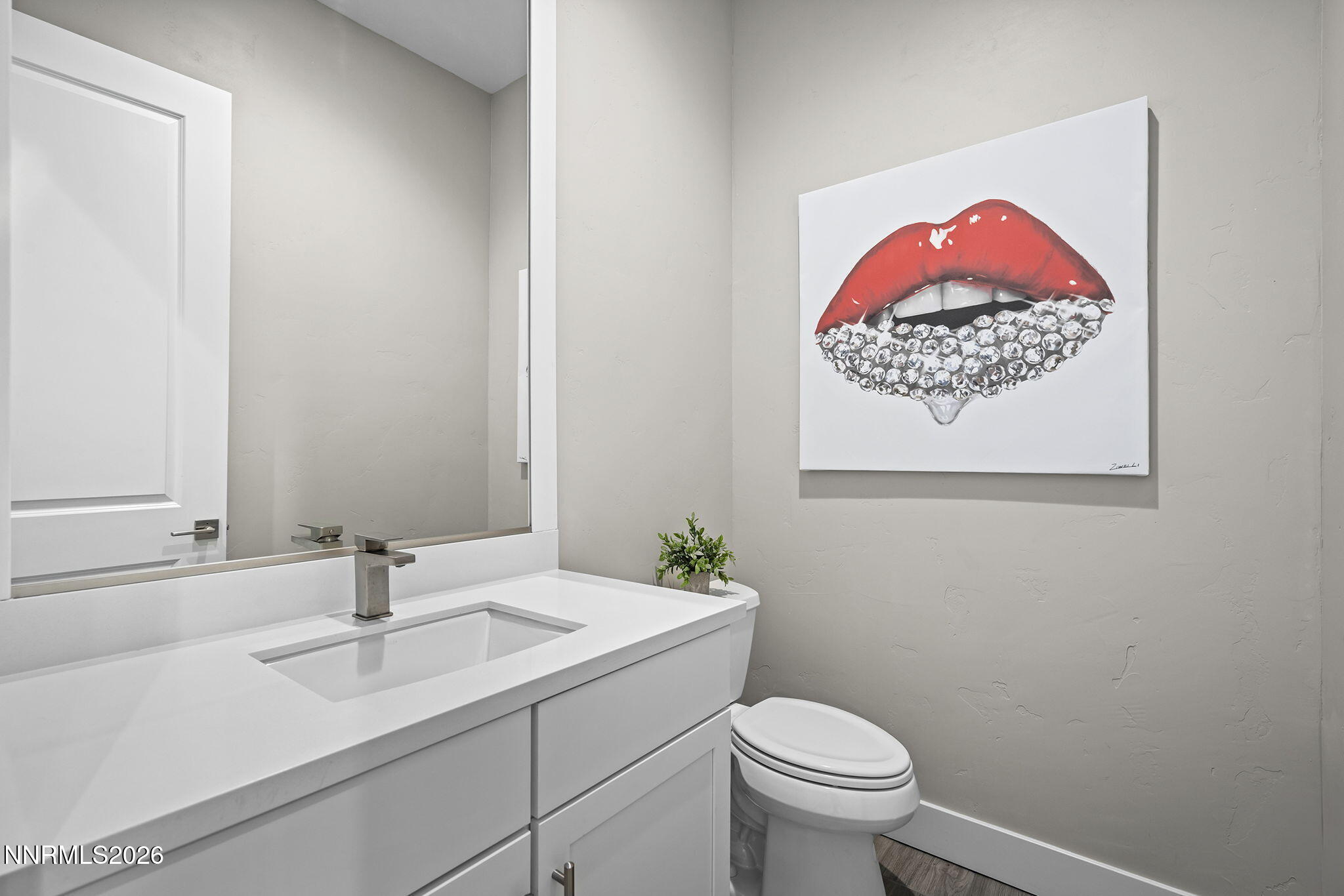 2945 Ruby Desert Drive Reno, NV 89521 - Photo 33 of 41 a bathroom with a toilet sink vanity and mirror