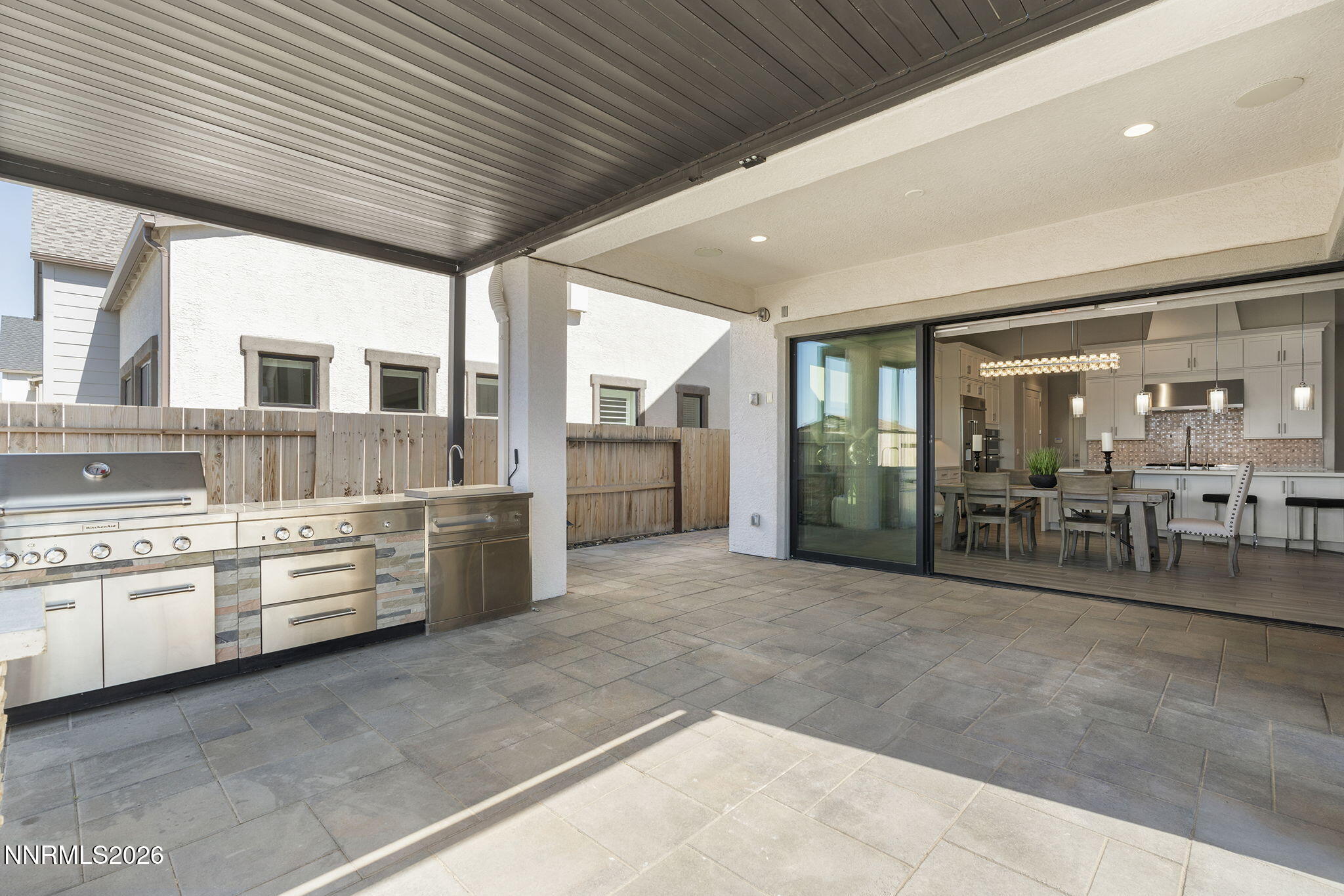 2945 Ruby Desert Drive Reno, NV 89521 - Photo 38 of 41 a large room with stainless steel appliances kitchen island granite countertop a large stove top oven and cabinets