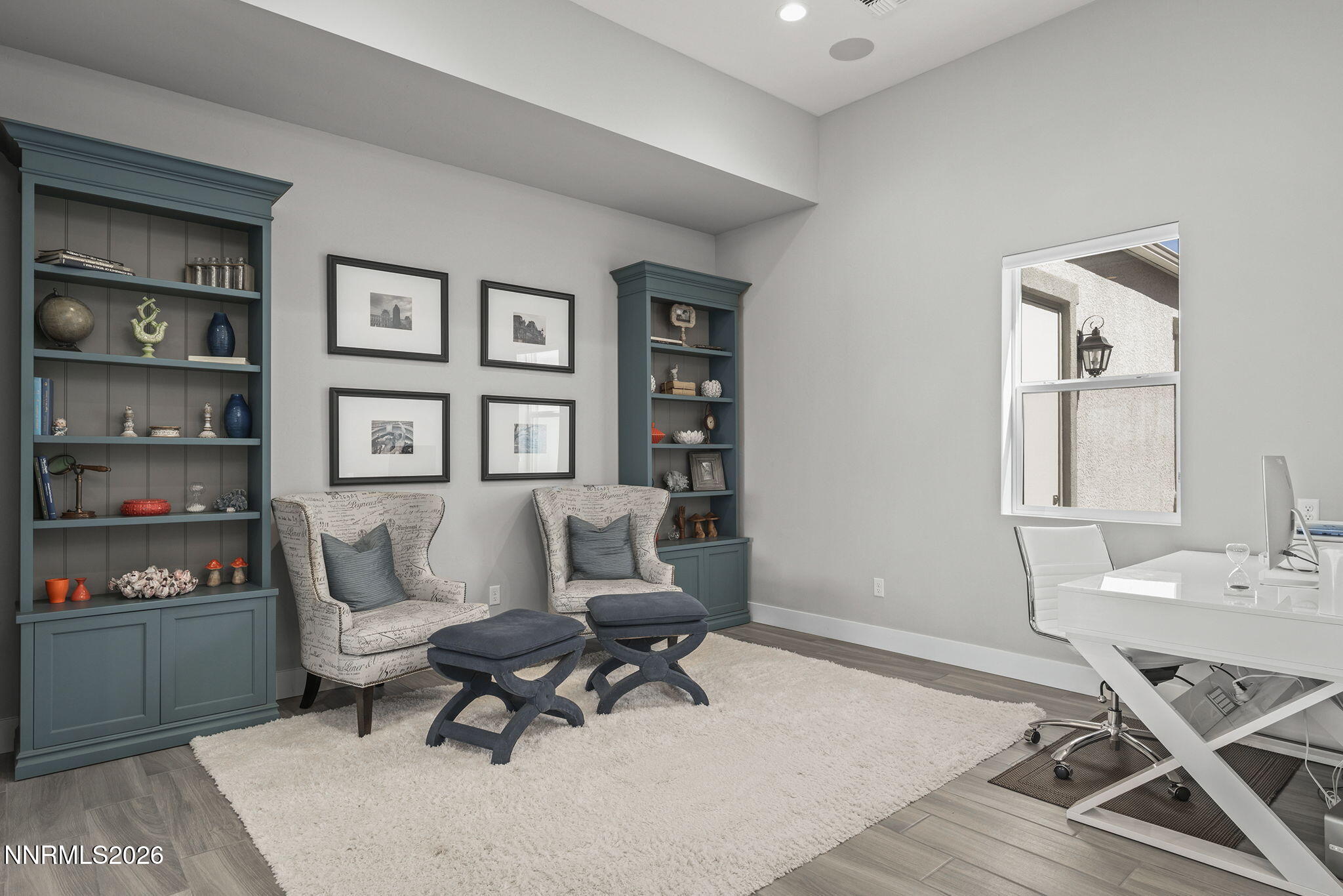 2945 Ruby Desert Drive Reno, NV 89521 - Photo 4 of 41 a living room with furniture a rug and a table