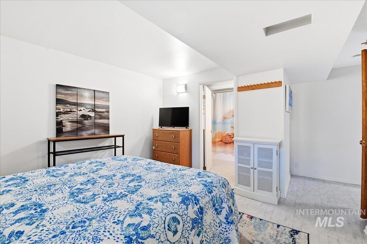 6710 West Ustick Road Boise, ID 83704 - Photo 24 of 42 Bedroom featuring white walls and light-toned flooring