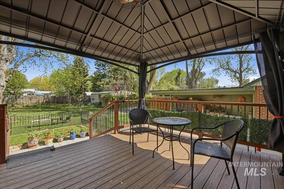 6710 West Ustick Road Boise, ID 83704 - Photo 40 of 42 Expansive outdoor deck featuring composite decking and a black metal gazebo with a canopy roof