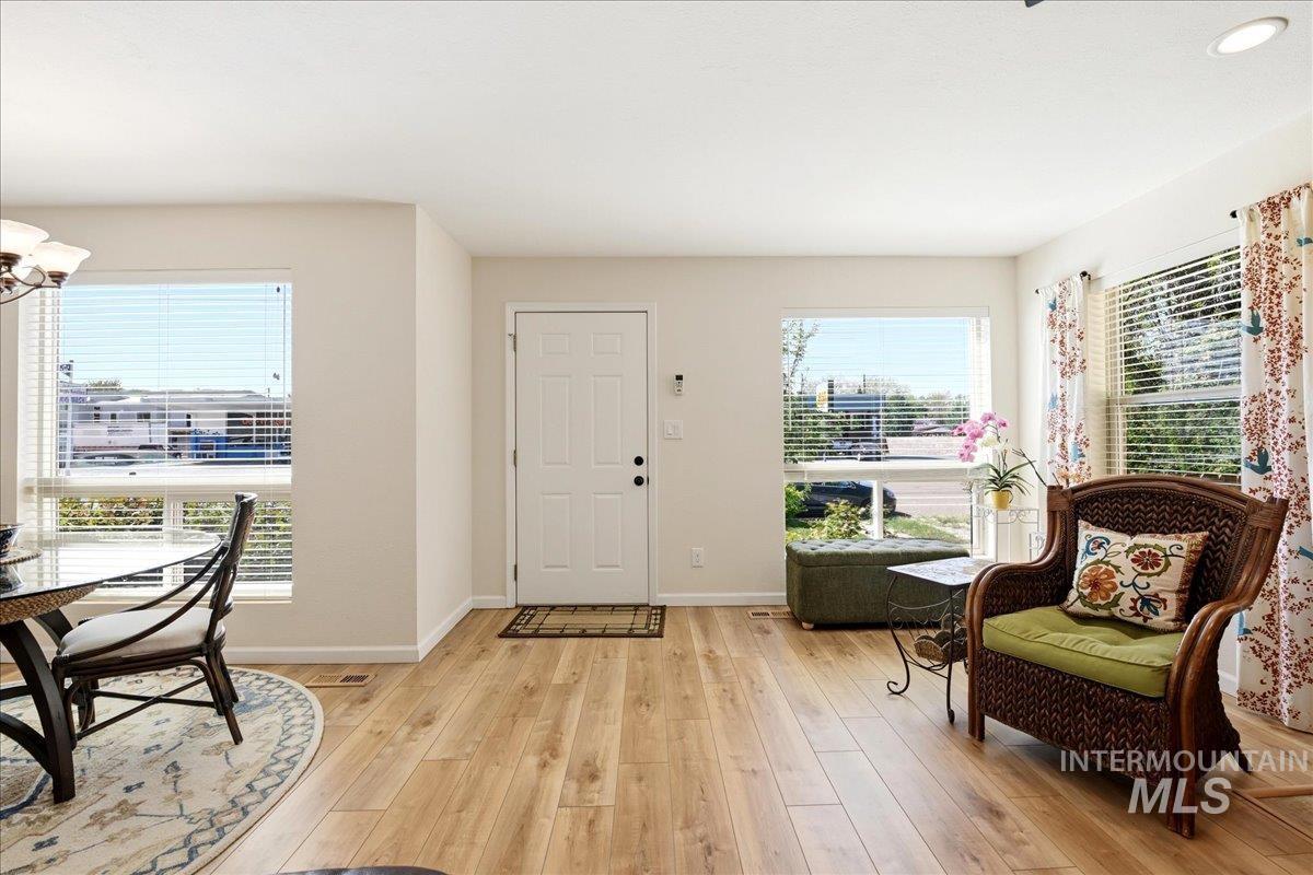 6710 West Ustick Road Boise, ID 83704 - Photo 5 of 42 Bright interior with wood-finish flooring extending throughout