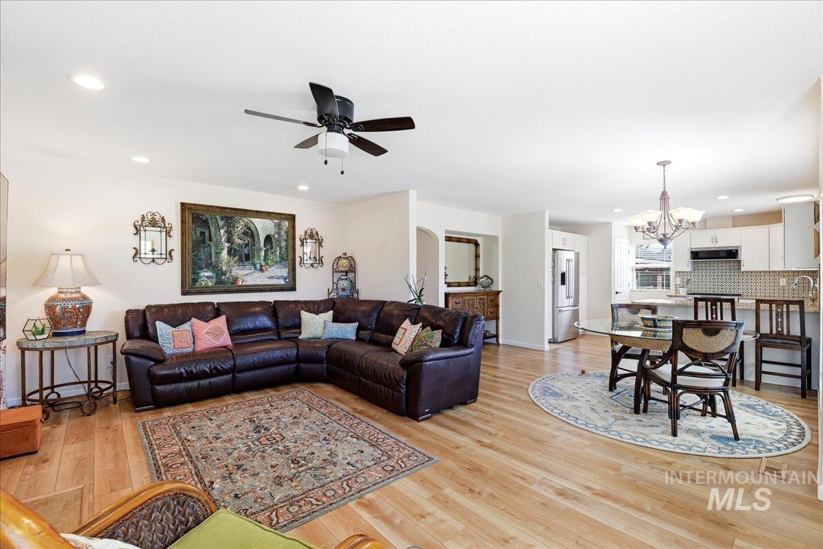 6710 West Ustick Road Boise, ID 83704 - Photo 8 of 42 Light wood-finish flooring throughout, recessed lighting, and a ceiling fan