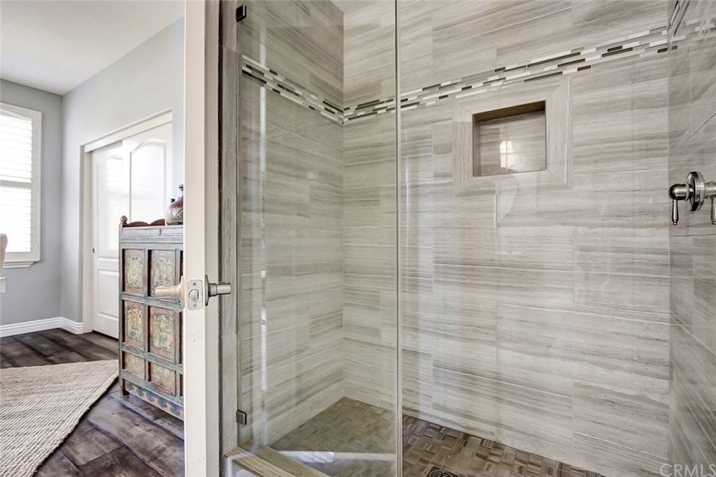 2911 Hawk Pointe Drive Fullerton, CA 92833 - Photo 12 of 55 Main Floor Remodeled En Suite 3/4 Bathroom Area Features: Custom Glass Enclosed Shower Area.
