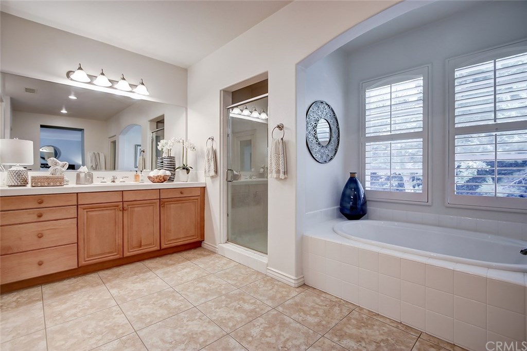 2911 Hawk Pointe Drive Fullerton, CA 92833 - Photo 35 of 55 Master Bathroom Area with Separate Glass Enclosed Shower, Separate Alcove Area with Soaking Tub, and Plantation Shutters.