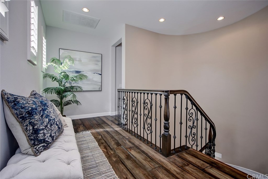 2911 Hawk Pointe Drive Fullerton, CA 92833 - Photo 36 of 55 2nd Floor Hallway Area Features: Wrought Iron Stairwell Handrail, Recessed Lighting, Plantation Shutters, and Hardwood Flooring.