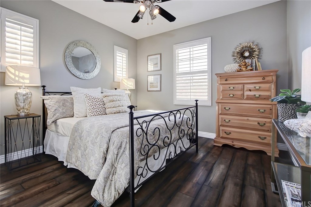 2911 Hawk Pointe Drive Fullerton, CA 92833 - Photo 37 of 55 2nd Floor Guest Bedroom Features: Ceiling Fan Light Fixture, Plantation Shutters, and Hardwood Flooring.