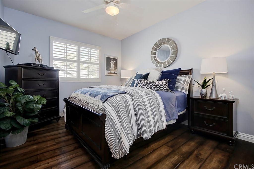 2911 Hawk Pointe Drive Fullerton, CA 92833 - Photo 39 of 55 2nd Floor Boy's Bedroom Features: Ceiling Fan Light Fixture, Plantation Shutters, and Hardwood Flooring.