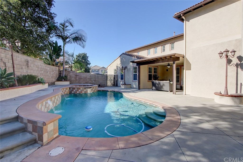 2911 Hawk Pointe Drive Fullerton, CA 92833 - Photo 45 of 55 Exterior Pool and Spa Yard Area with View to Adjacent Covered Patio Area.