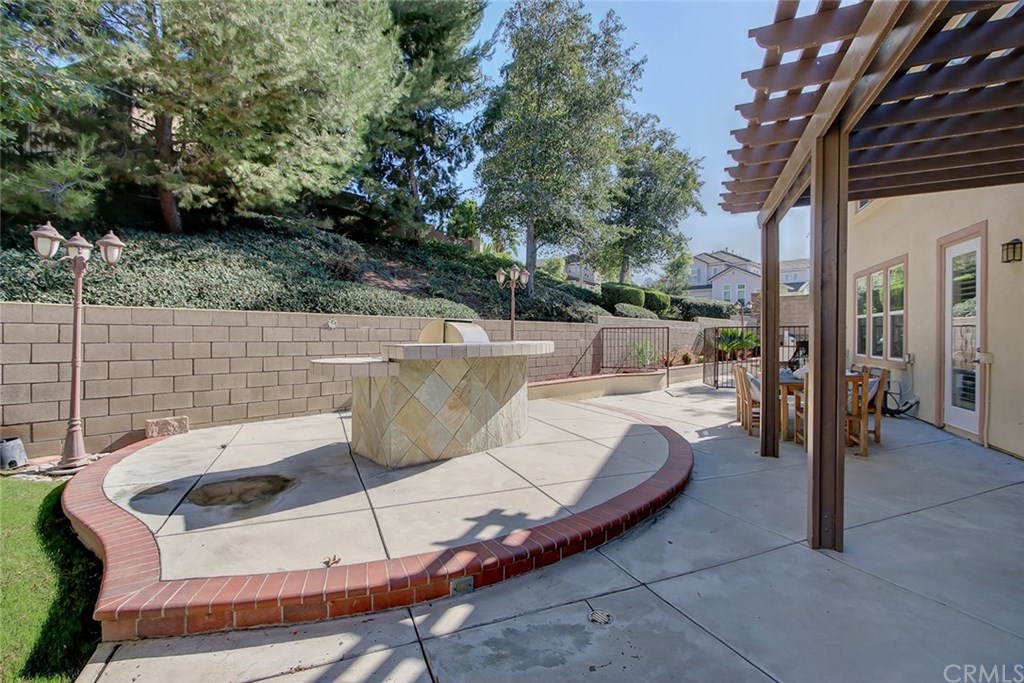 2911 Hawk Pointe Drive Fullerton, CA 92833 - Photo 48 of 55 Exterior Backyard Outdoor Kitchen Island Area with Built-In BBQ and Adjacent Patio.