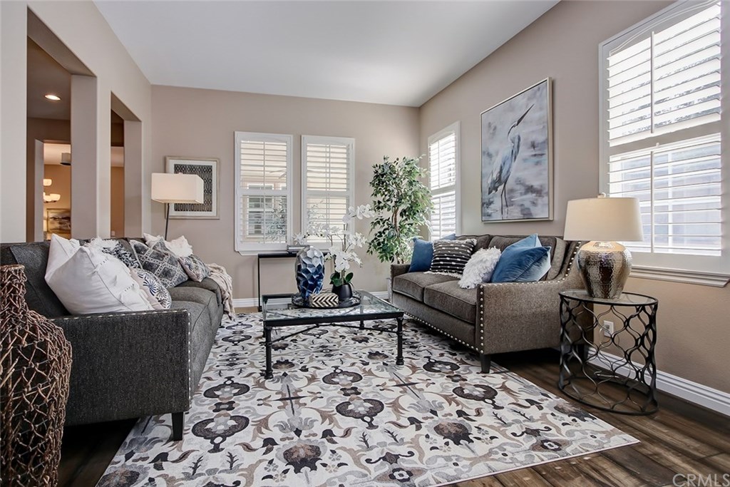 2911 Hawk Pointe Drive Fullerton, CA 92833 - Photo 6 of 55 Main Floor Formal Living Area Features: Plantation Shutters, Hardwood Flooring, and Open Space Access.