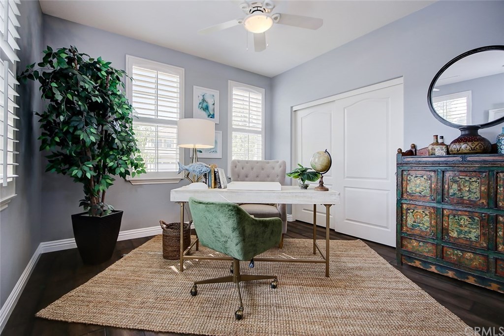 2911 Hawk Pointe Drive Fullerton, CA 92833 - Photo 9 of 55 Main Floor En Suite Bedroom/At-Home-Office Area Features: Ceiling Fan Light Fixture, Plantation Shutters, and Hardwood Flooring.