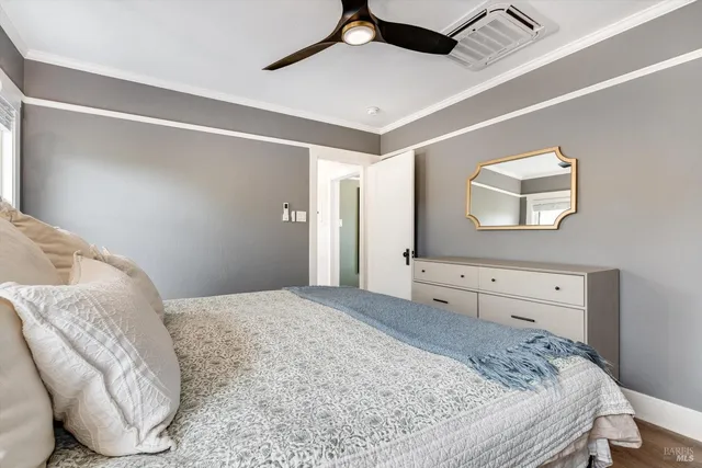 a bedroom with a bed and a dresser