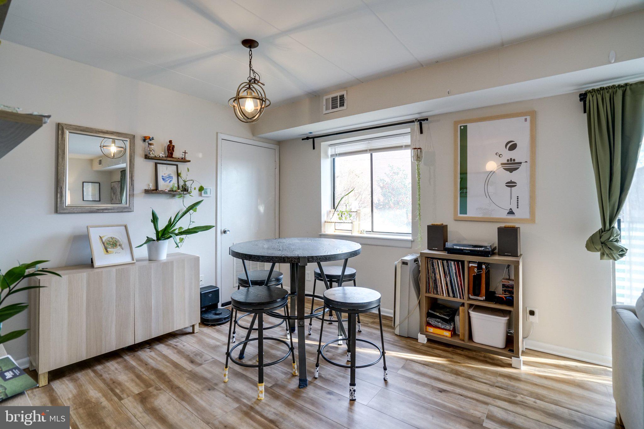 6240 Edsall Road, Unit 202 Alexandria, VA 22312 - Photo 4 of 13 a view of a livingroom with furniture wooden floor and a window