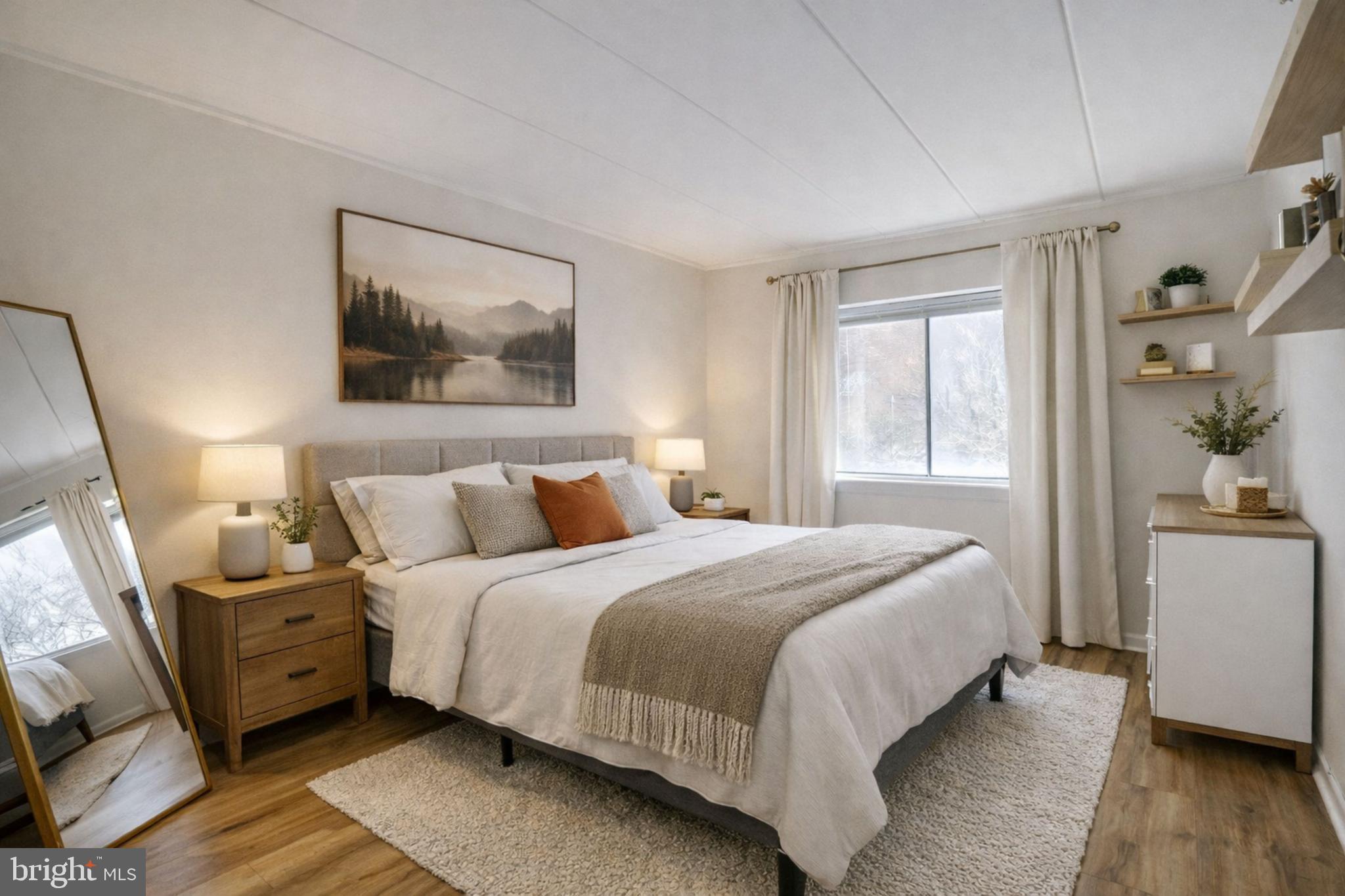 6240 Edsall Road, Unit 202 Alexandria, VA 22312 - Photo 5 of 13 a bedroom with bed and wooden floor