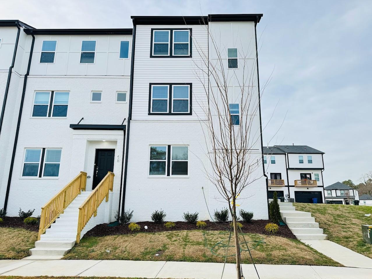 428 Sustainable Way Raleigh, NC 27610 - Photo 1 of 22 a front view of a house with a yard
