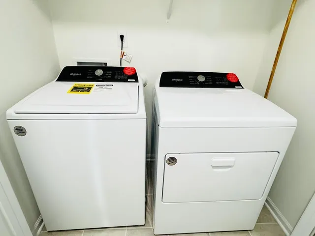 a utility room with dryer and washer