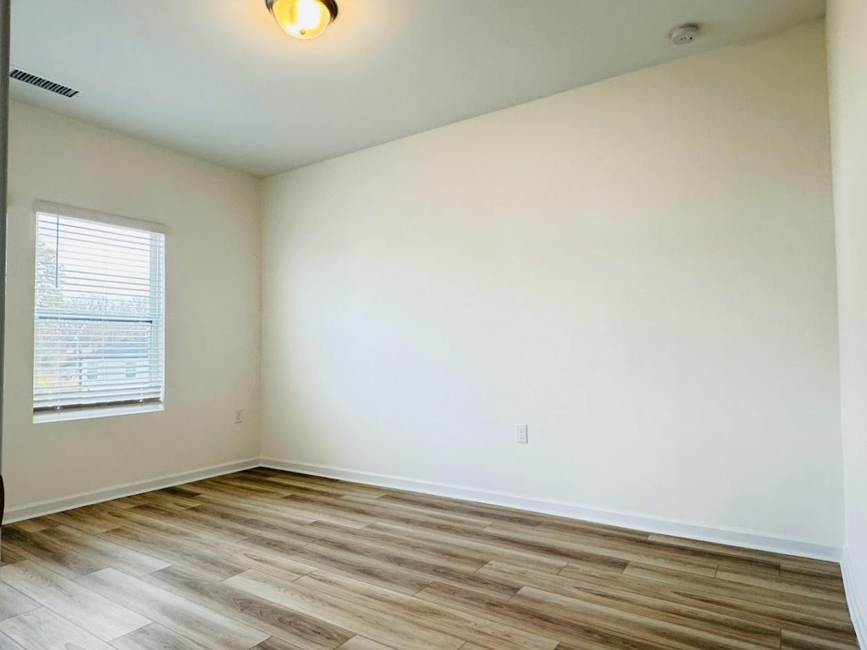 428 Sustainable Way Raleigh, NC 27610 - Photo 20 of 22 a view of an empty room and window
