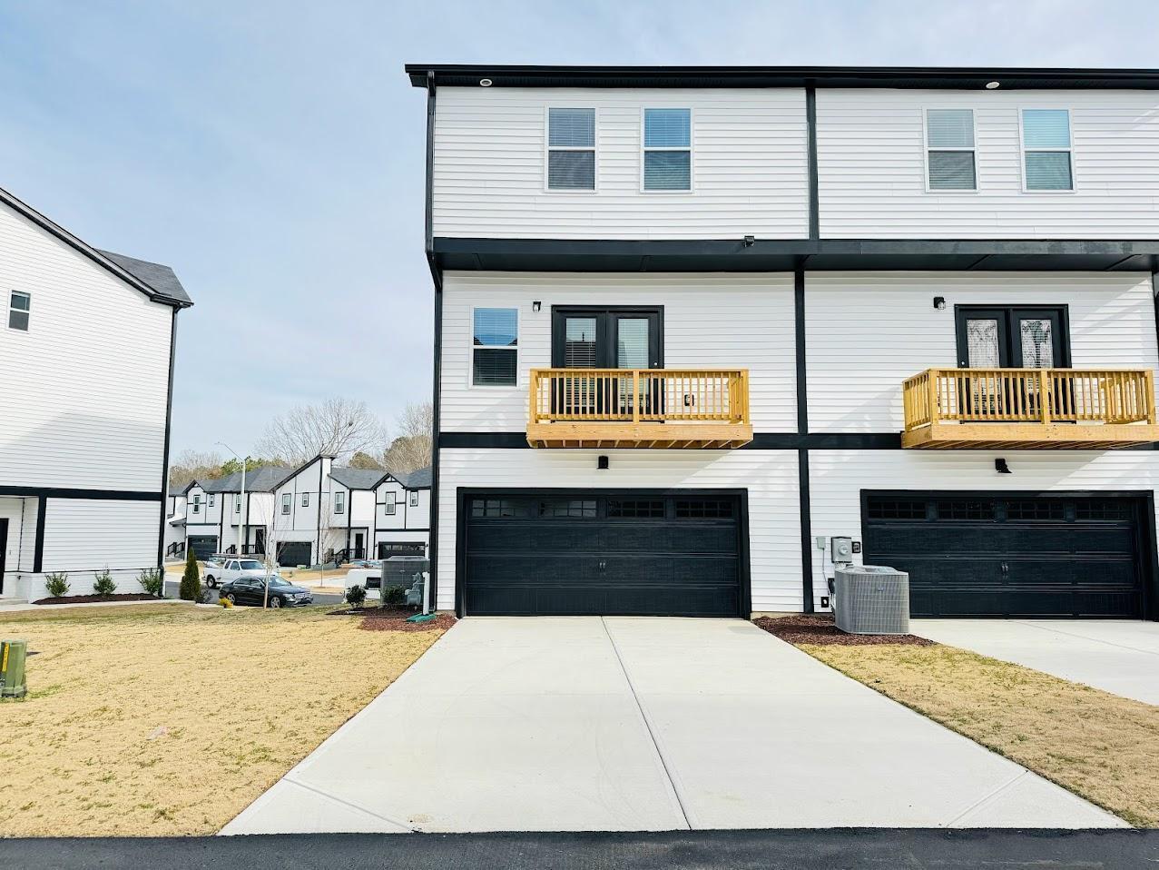 428 Sustainable Way Raleigh, NC 27610 - Photo 2 of 22 a front view of a house with a yard