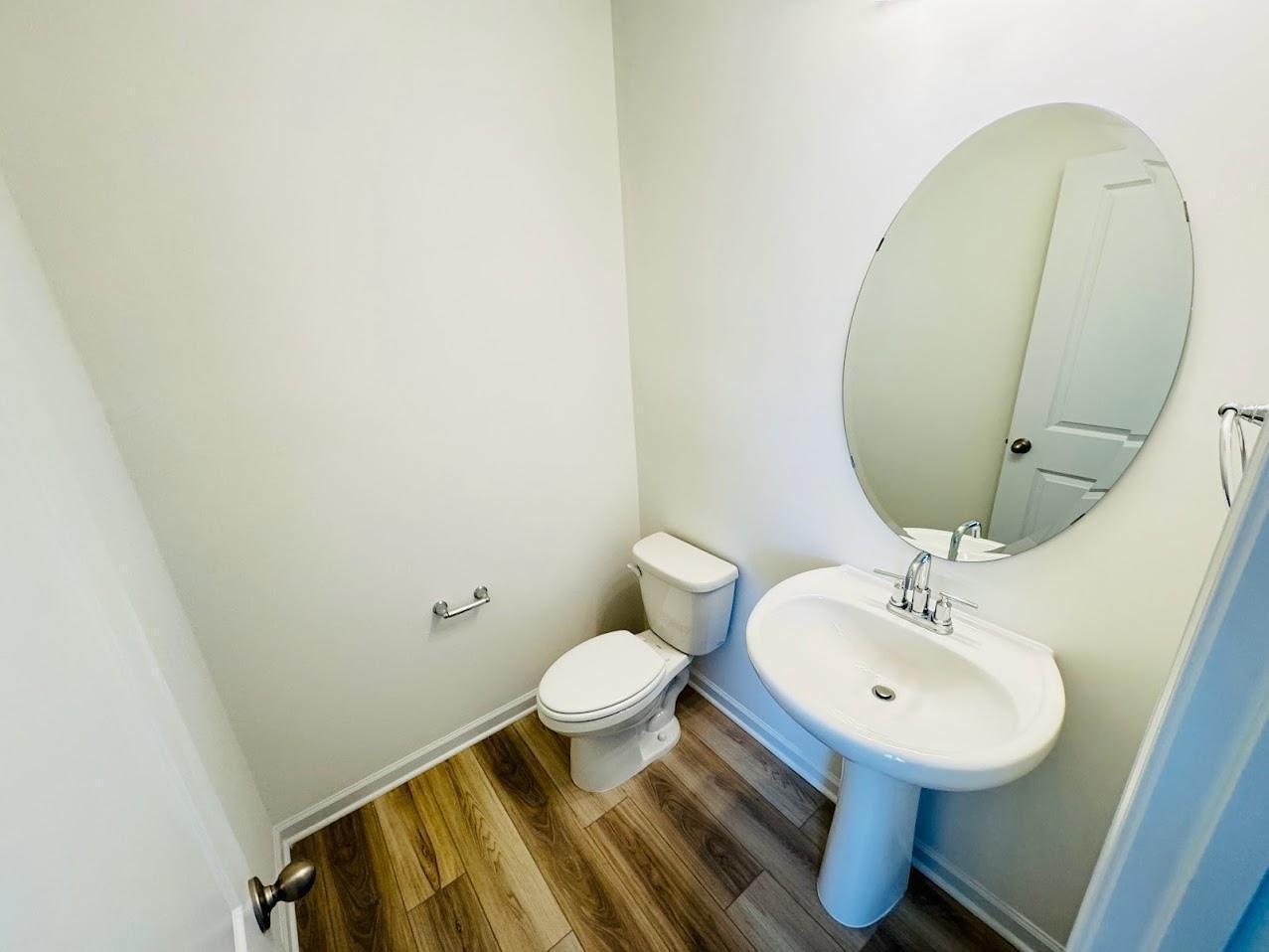 428 Sustainable Way Raleigh, NC 27610 - Photo 10 of 22 a bathroom with a sink and a mirror
