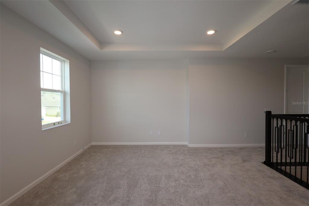 5184 Prairie Preserve Run St. Cloud, FL 34772 - Photo 17 of 36 en empty room with windows