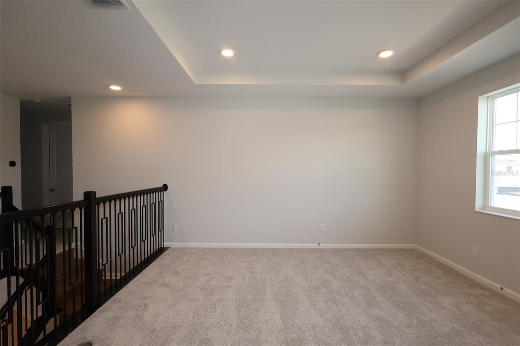 5184 Prairie Preserve Run St. Cloud, FL 34772 - Photo 18 of 36 an empty room with windows