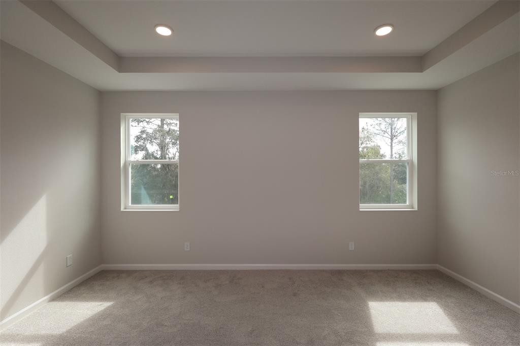 5184 Prairie Preserve Run St. Cloud, FL 34772 - Photo 21 of 36 an empty room with windows