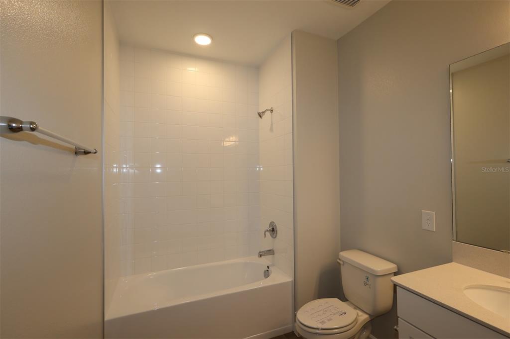 5184 Prairie Preserve Run St. Cloud, FL 34772 - Photo 24 of 36 a white toilet sitting next to a bath tub