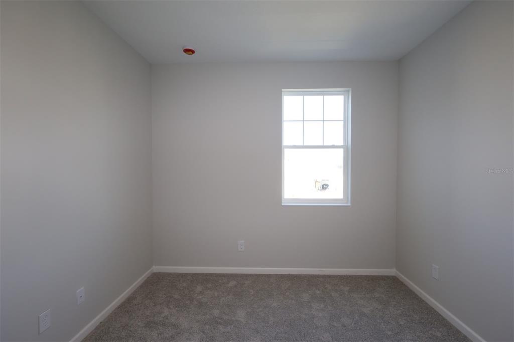 5184 Prairie Preserve Run St. Cloud, FL 34772 - Photo 10 of 36 an empty room with a window