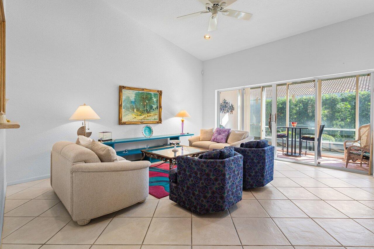 8398 Vía Serena Boca Raton, FL 33433 - Photo 11 of 50 a living room with furniture and a large window