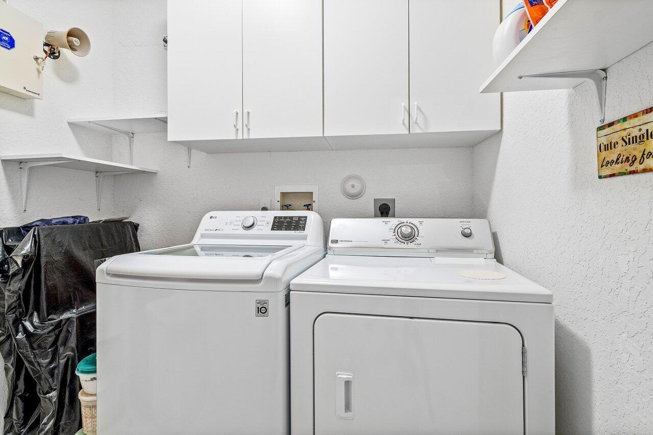 8398 Vía Serena Boca Raton, FL 33433 - Photo 16 of 50 a utility room with dryer and washer