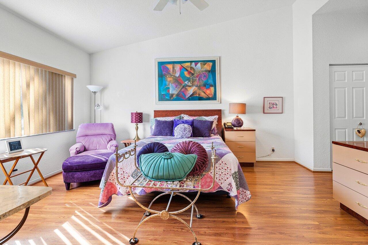 8398 Vía Serena Boca Raton, FL 33433 - Photo 17 of 50 a living room with furniture a rug and wall painting