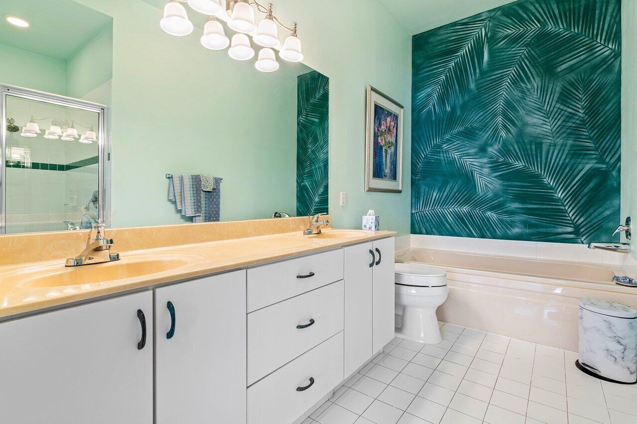 8398 Vía Serena Boca Raton, FL 33433 - Photo 20 of 50 a bathroom with a granite countertop sink mirror vanity and toilet